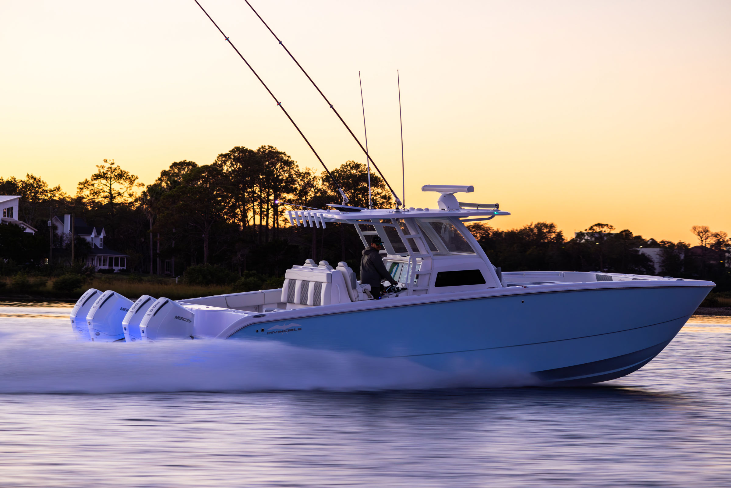 Invincible 38' Catamaran side profile view on the water