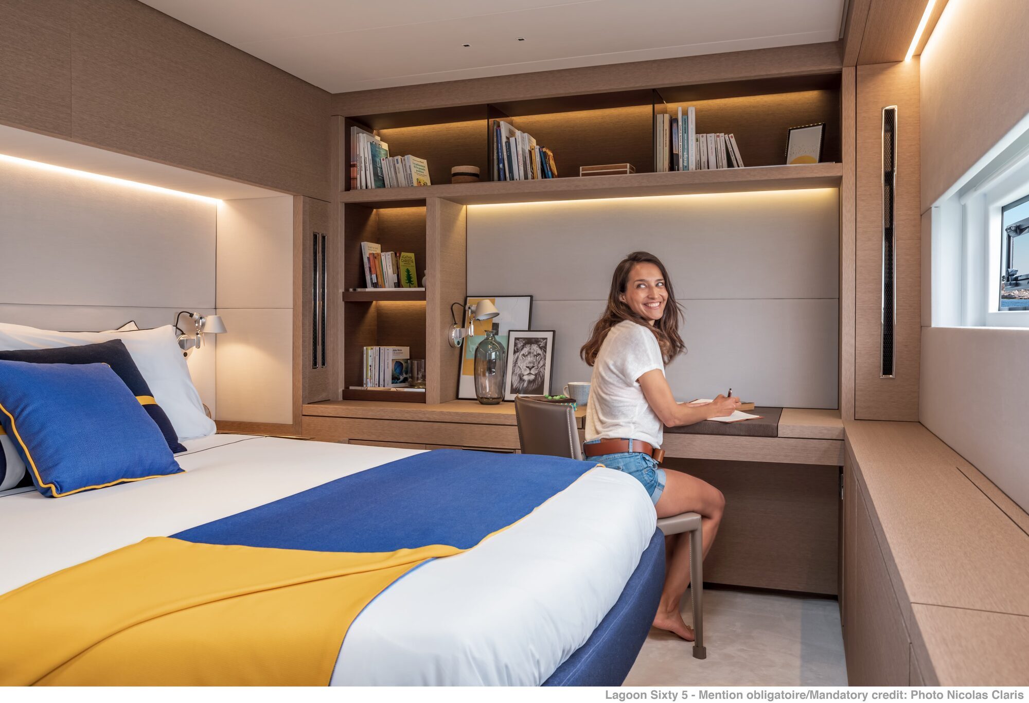 Lagoon 65 catamaran cabin with double berth and integrated desk area Lagoon 65 catamaran cabin with double berth and integrated desk area