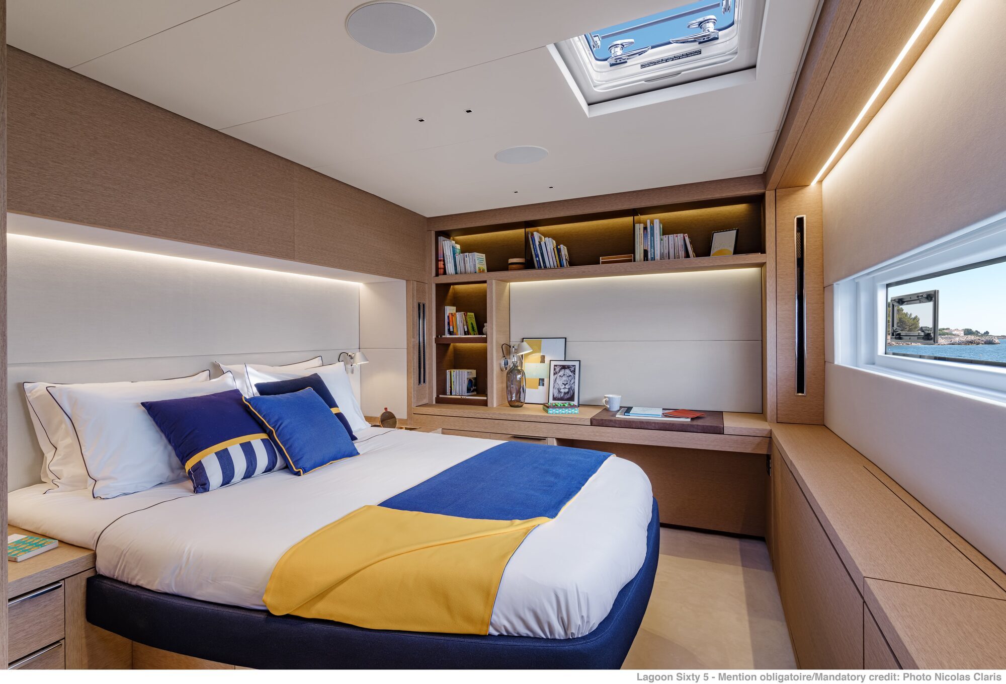 cabin with double bed, desk area, and storage cabin with double bed, desk area, and storage