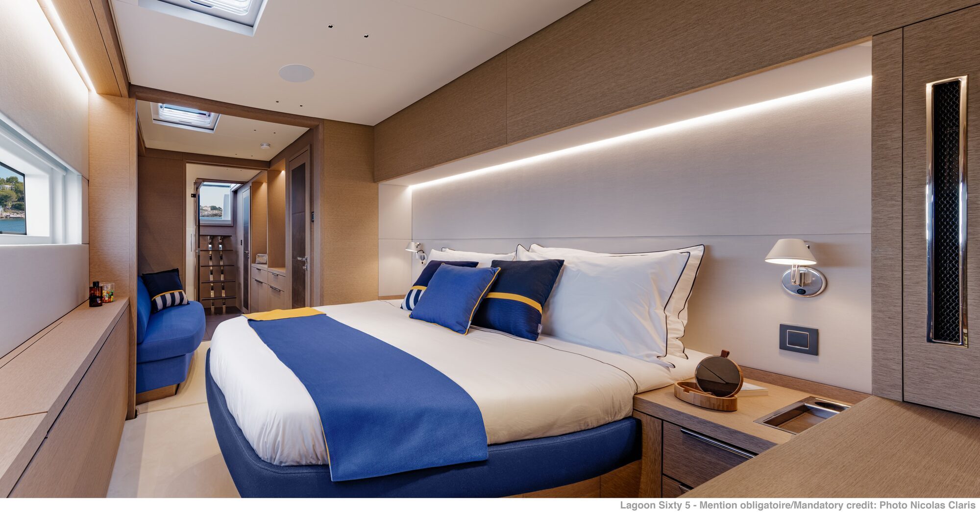 agoon Sixty 5 catamaran cabin showing double bed and side seating agoon Sixty 5 catamaran cabin showing double bed and side seating